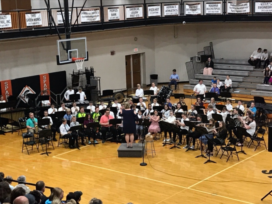 band seated in chairs